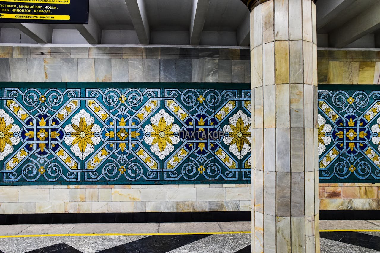 Colorful decorative tiles at Paxtakor metro station in Tashkent, showcasing socialist architecture.