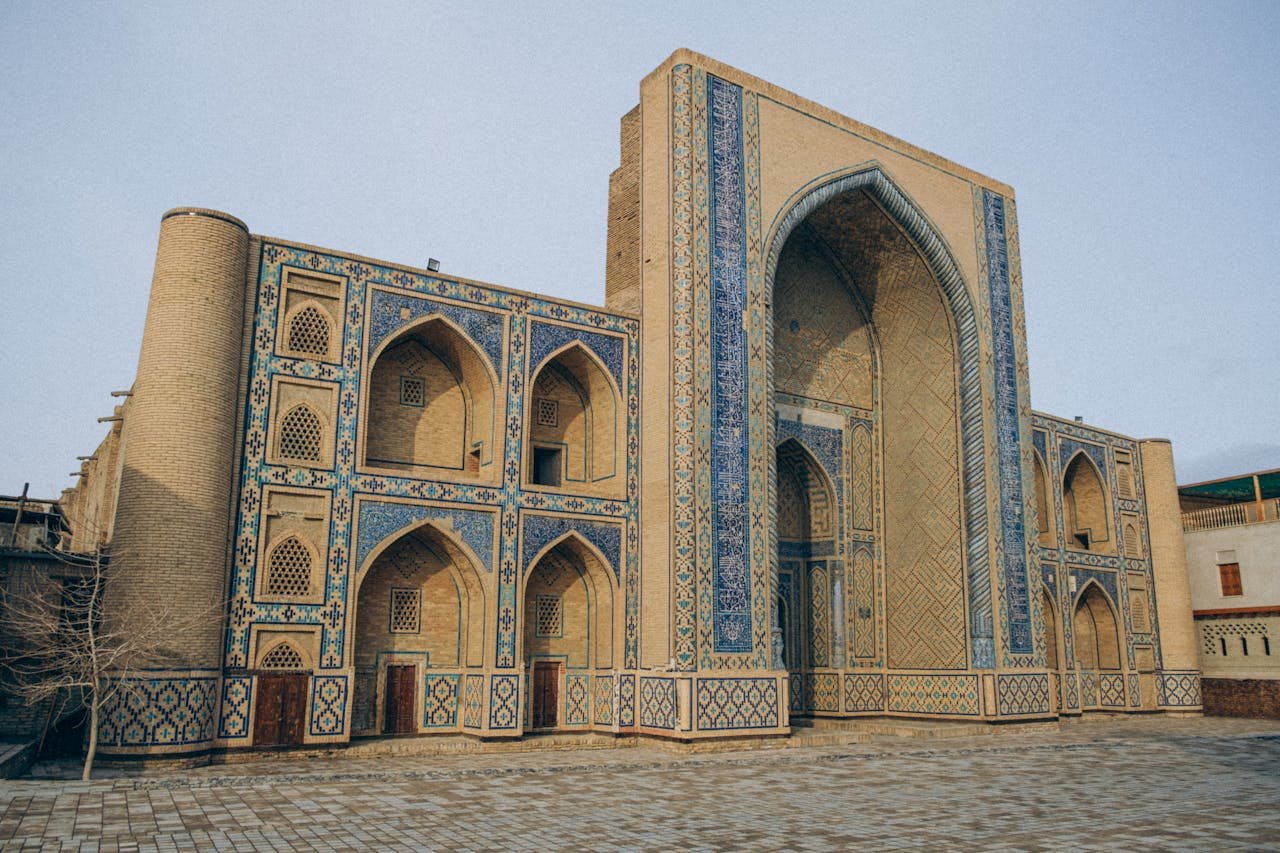 A captivating view of ornate Islamic architecture with stunning blue tilework.